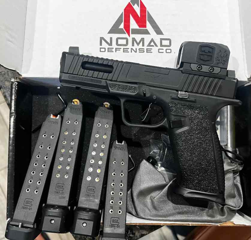 Gen 5 glock 17 with enclosed red dot.